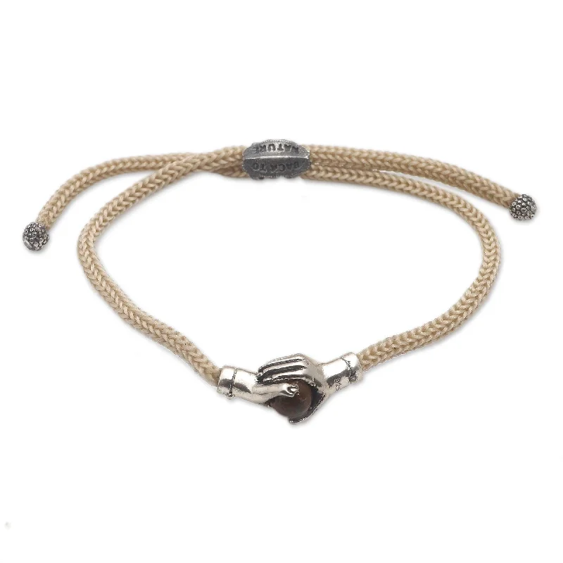 Women’s gold charm bracelets-Novica Handmade Silver Beige Handshake Sterling Silver And Tiger'S Eye Unity Bracelet