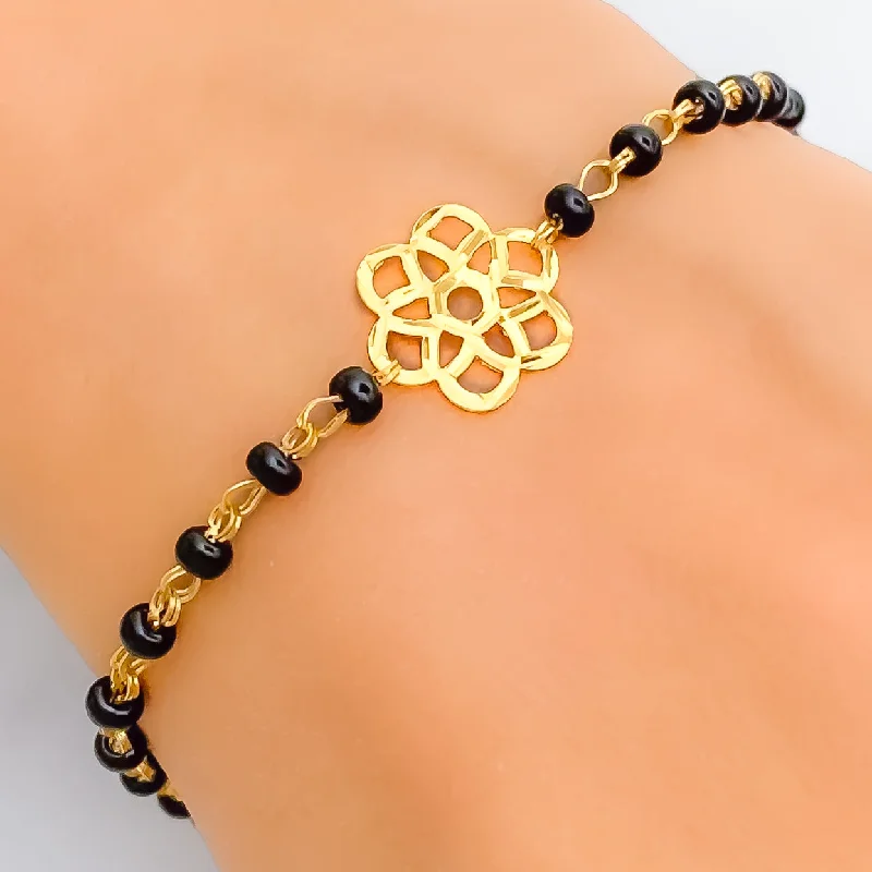 Women’s black leather bracelets-Subtle Flower 22k Gold Black Bead Bracelet