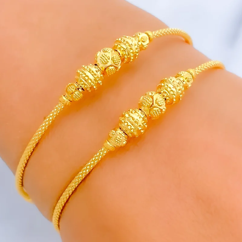 Women’s fashion bangles-Stately Striped 22k Gold Bangle Bracelet Pair