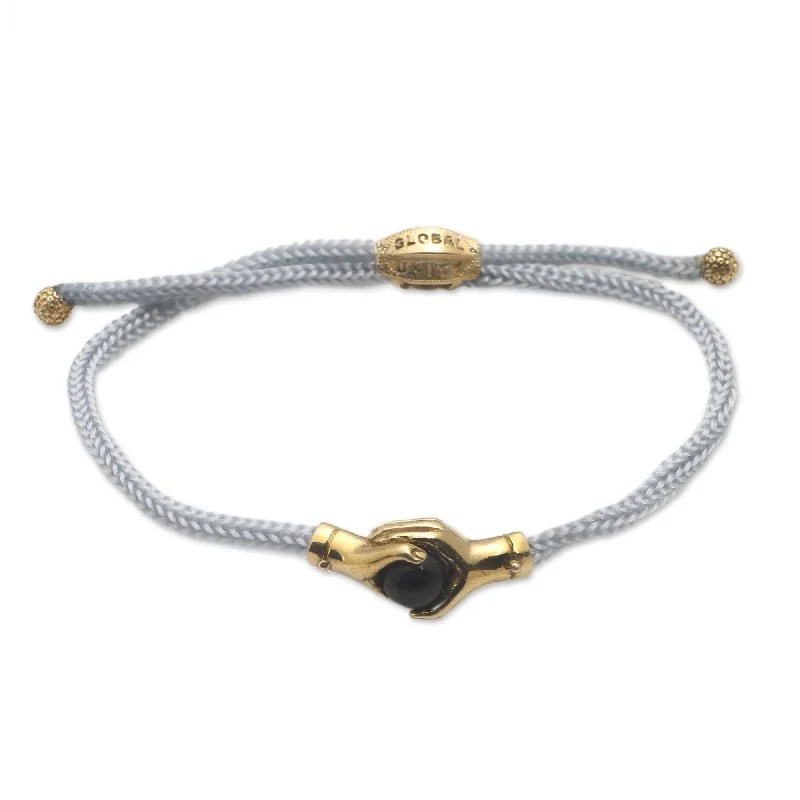 Women’s minimalistic bracelets-Novica Handmade Golden Grey Handshake Brass And Black Agate Unity Bracelet