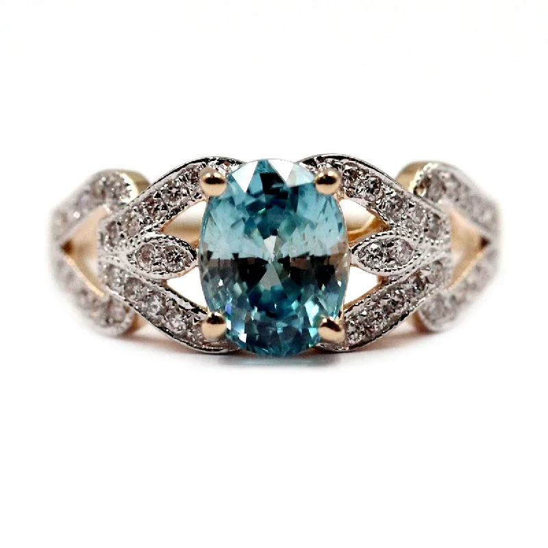 Women’s oval rings-14Kt Yellow Gold Blue Zircon and Diamond Ring