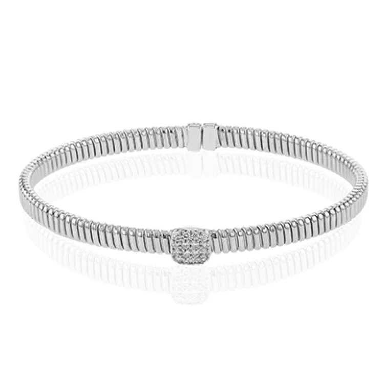 Women’s delicate bracelets-This modern design 18k white gold textured bangle with .19ctw diamonds set in a cushion shape and magnetic closure, is perfect for stacking