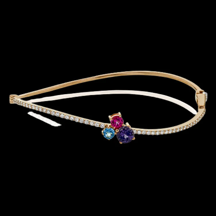 Women’s diamond-studded bracelets-This dynamic 18k rose gold bangle makes a swooping entrance with three 1.03 ctw red spinels at its center.