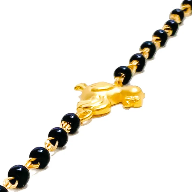 Women’s friendship bangles-Radiant Sleek 22k Gold Black Bead Baby Bracelet