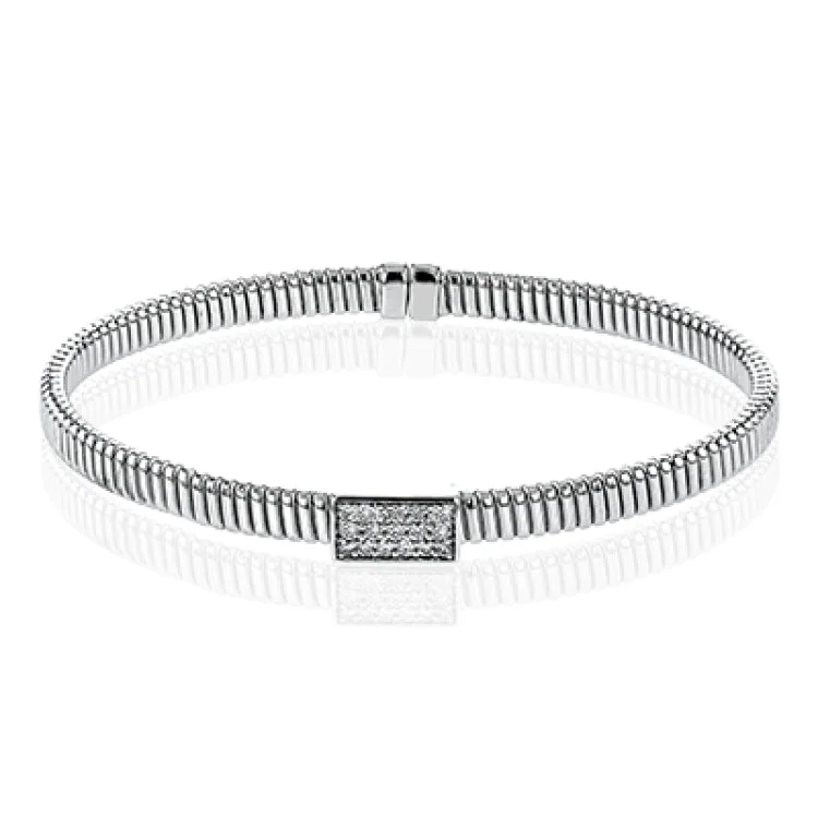 Women’s wrap bracelets-18k White gold textured bangle is highlighted by .25 ctw of diamonds set in a rectangular design. Perfect for stacking